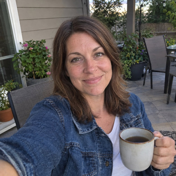 Customer selfie on her patio with a mug