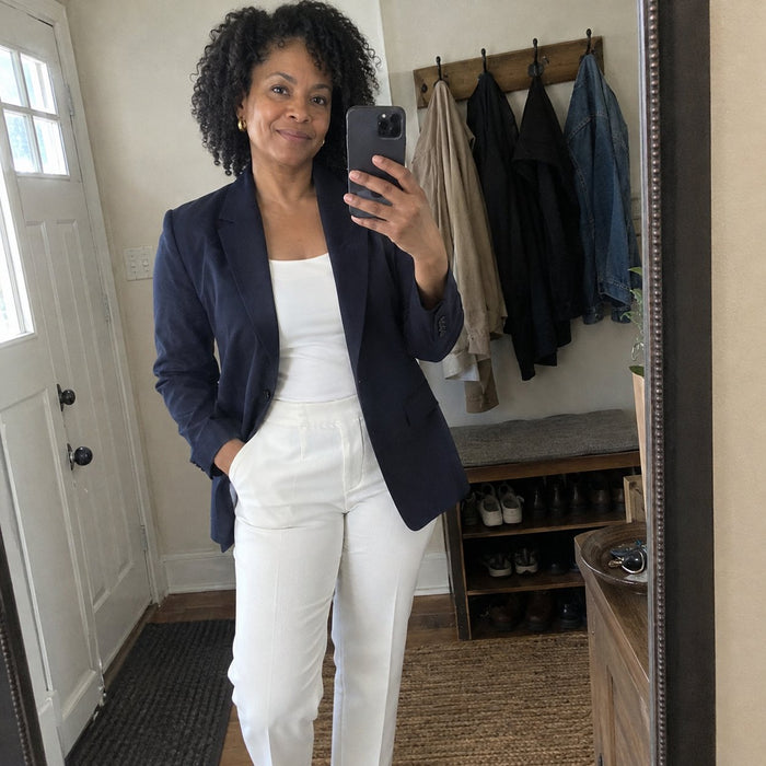 Customer mirror selfie in a navy blazer