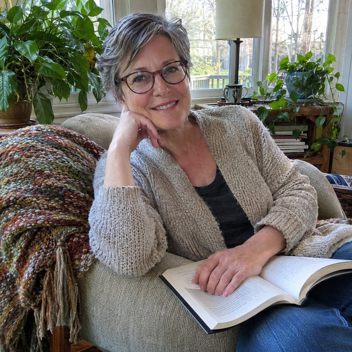 Customer in her reading nook with a book